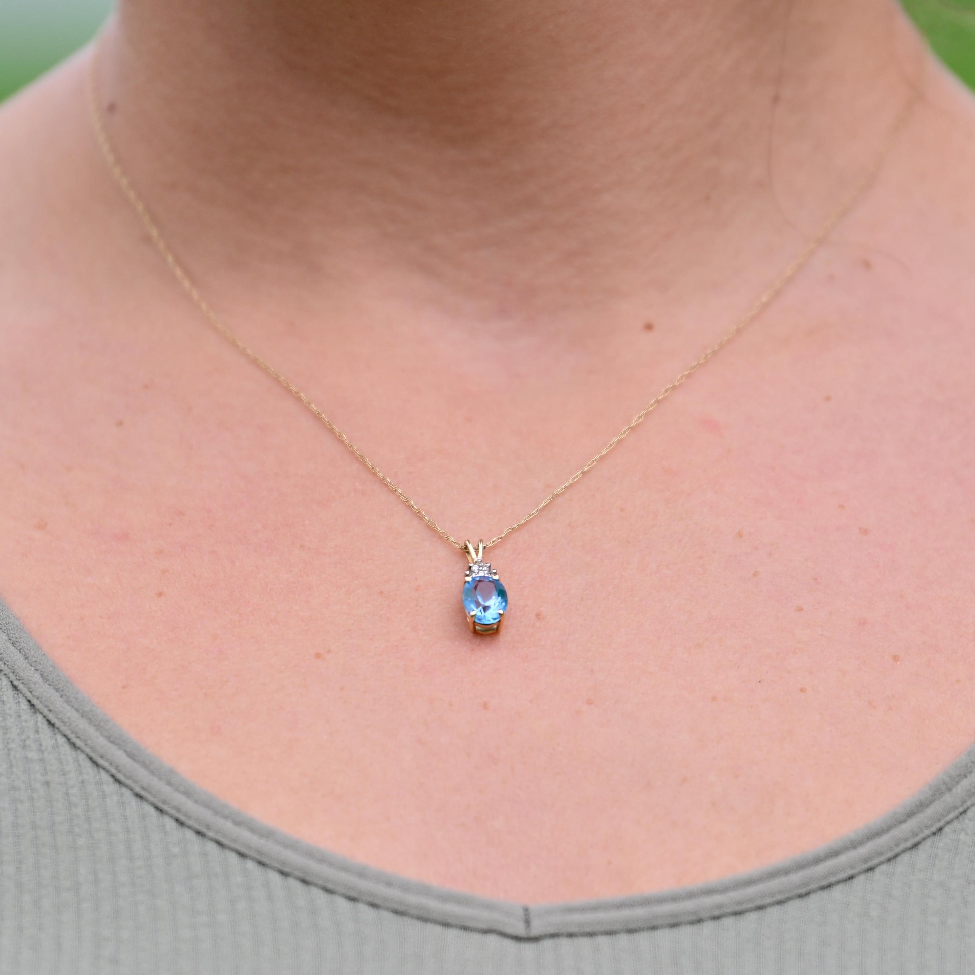 Blue Topaz Oval and Diamond Pendant on Chain in 14K Yellow Gold