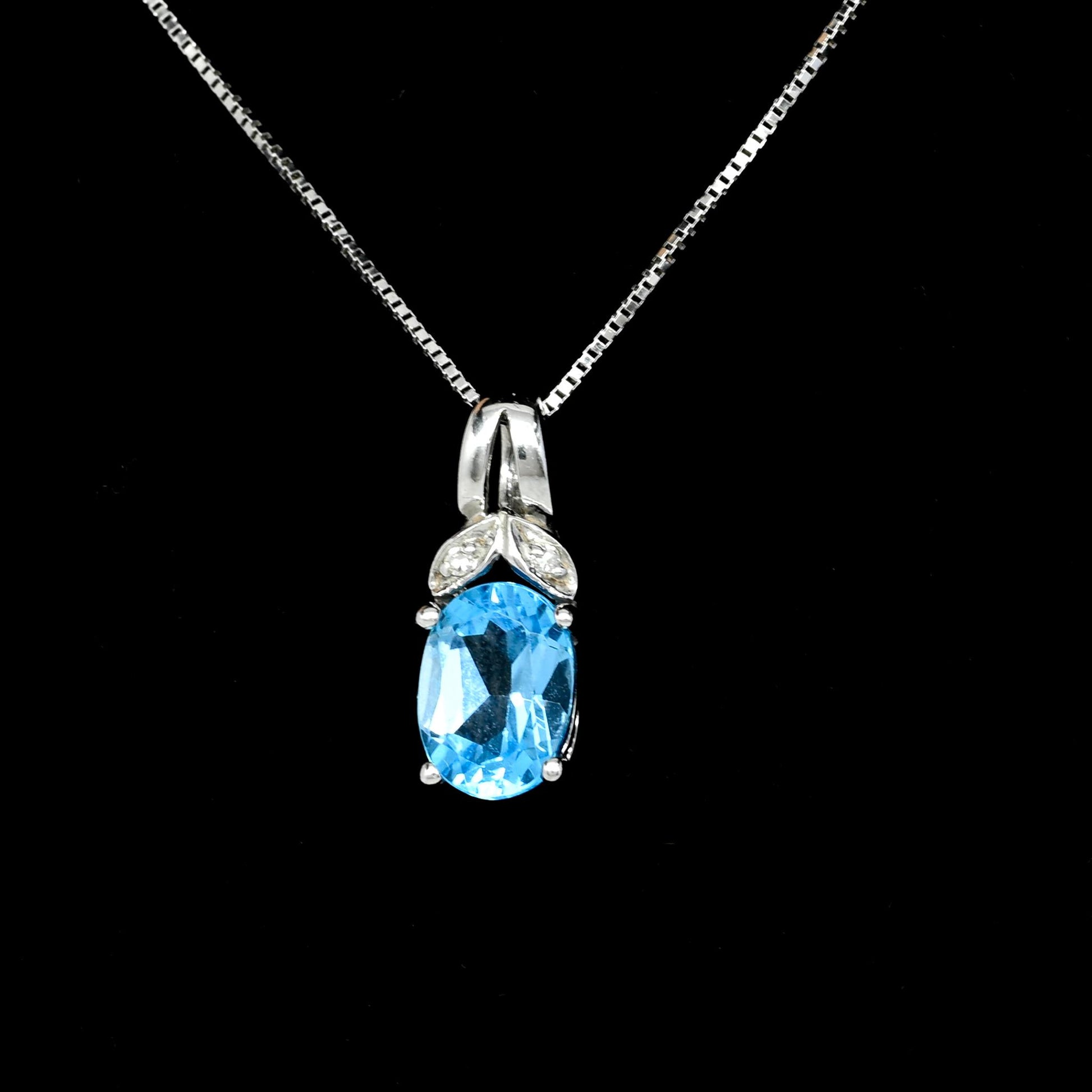 Blue Topaz Oval Diamond Accent White Gold Pendant