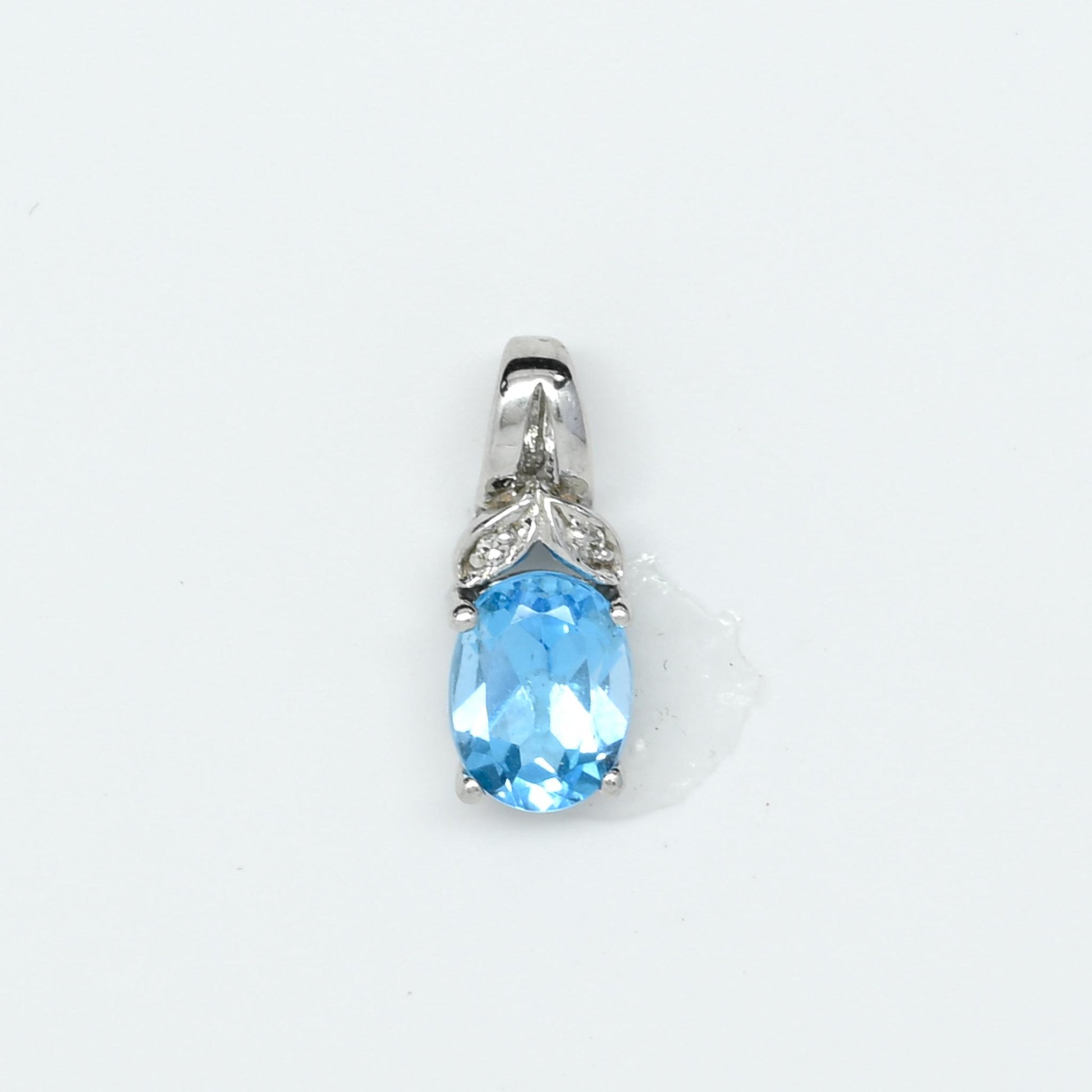 Blue Topaz Oval Diamond Accent White Gold Pendant