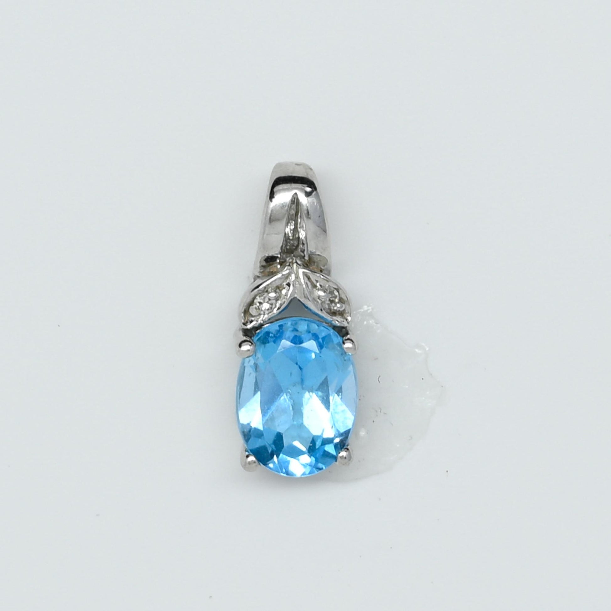 Blue Topaz Oval Diamond Accent White Gold Pendant