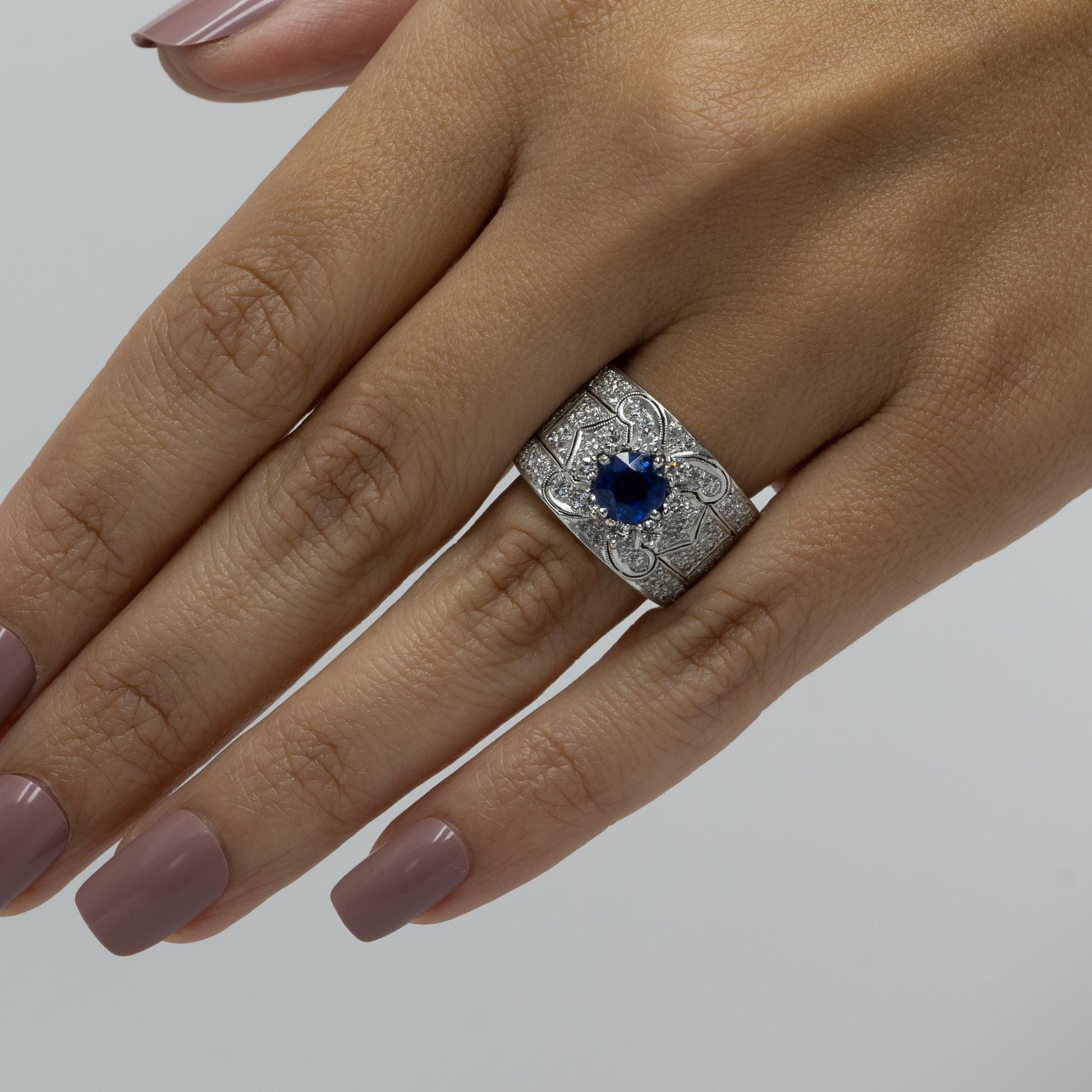 Vivid Blue Round Sapphire in Wide Diamond 18k White Gold Ring