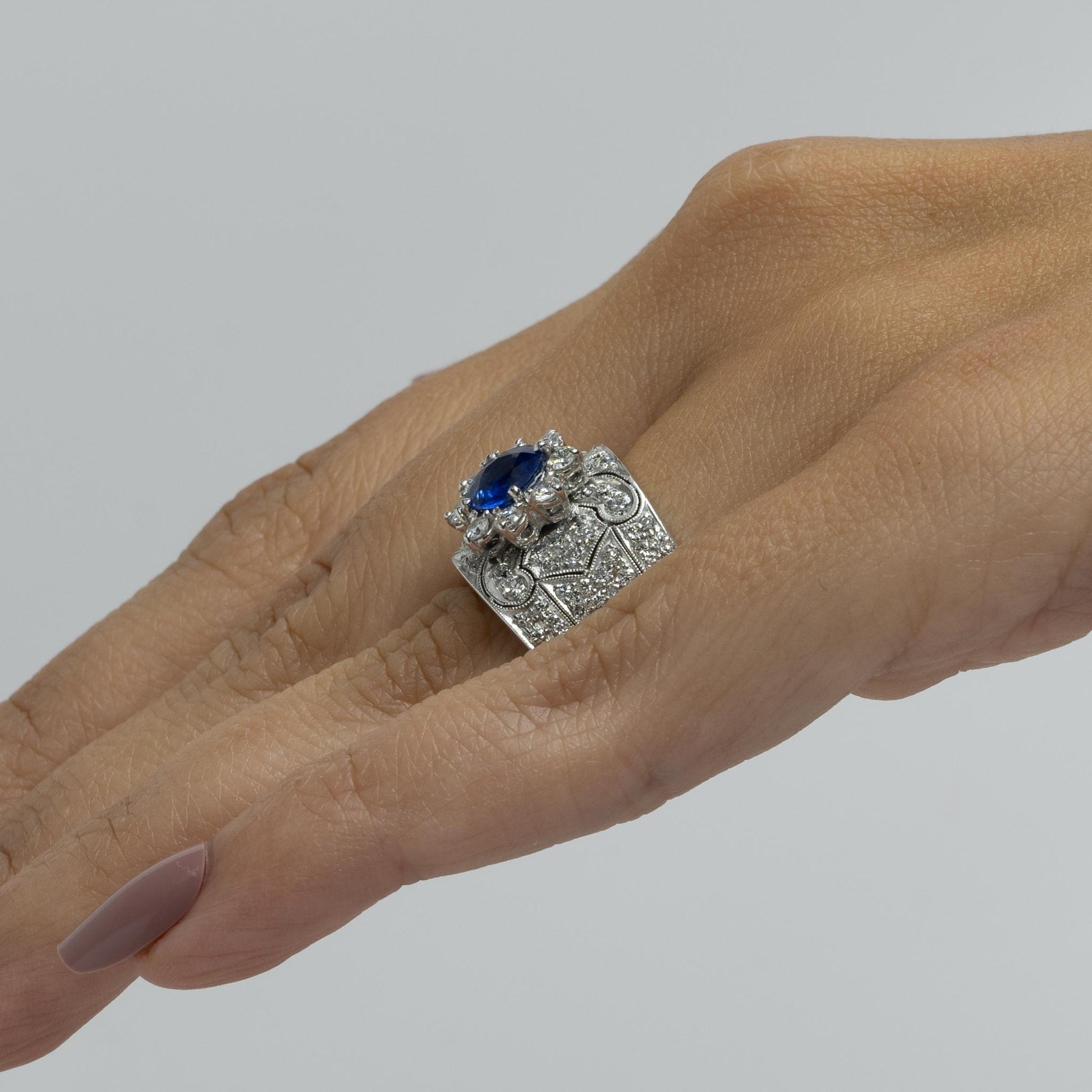 Vivid Blue Round Sapphire in Wide Diamond 18k White Gold Ring