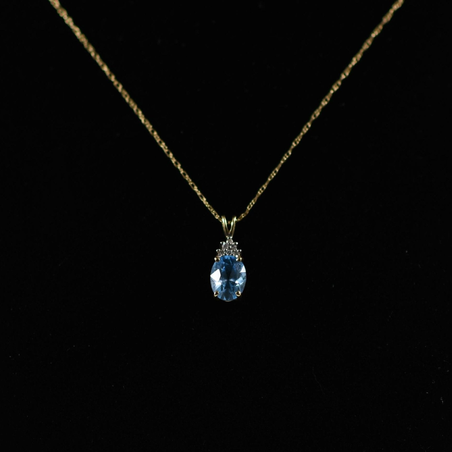 Blue Topaz Oval and Diamond Pendant on Chain in 14K Yellow Gold