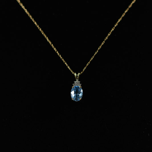 Blue Topaz Oval and Diamond Pendant on Chain in 14K Yellow Gold