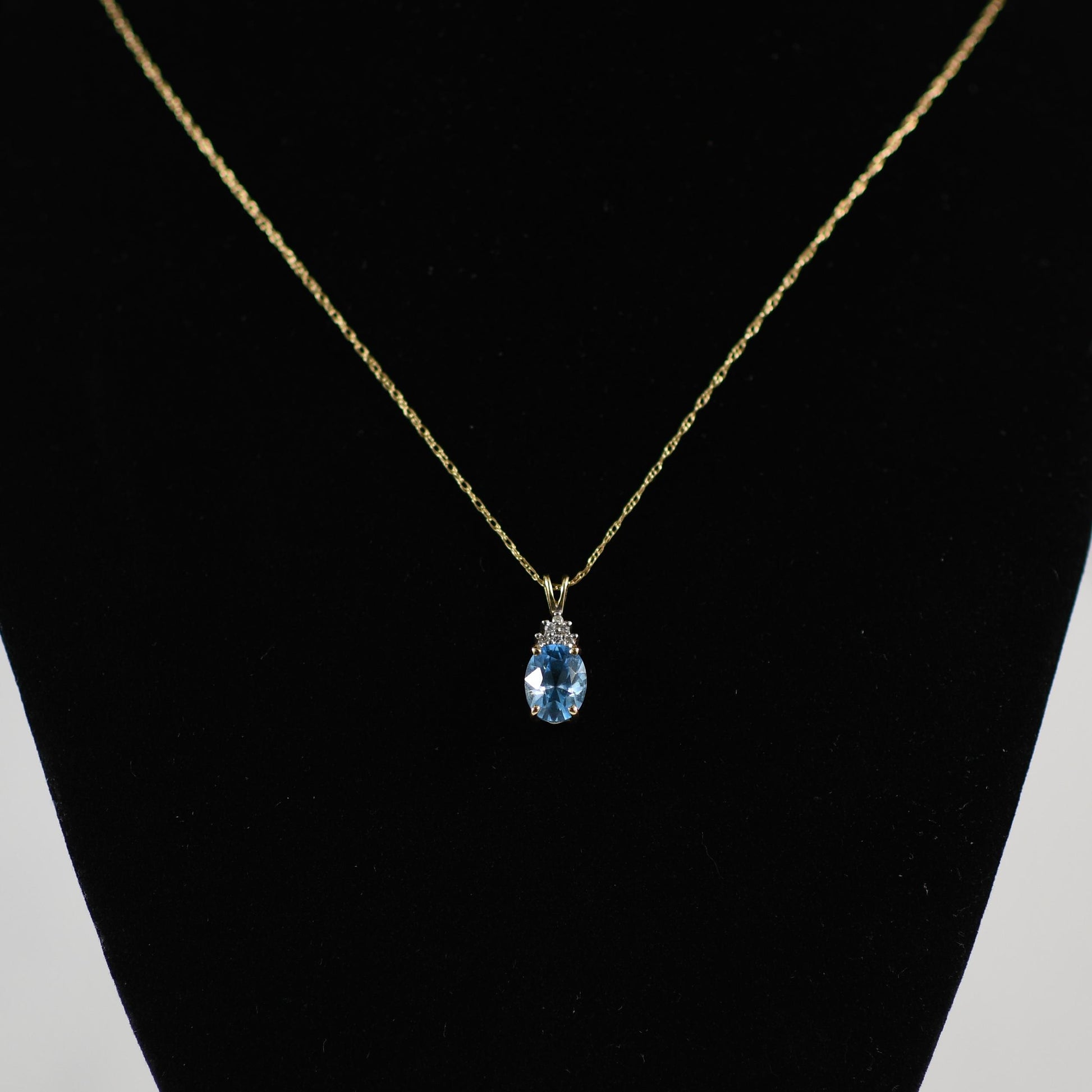 Blue Topaz Oval and Diamond Pendant on Chain in 14K Yellow Gold