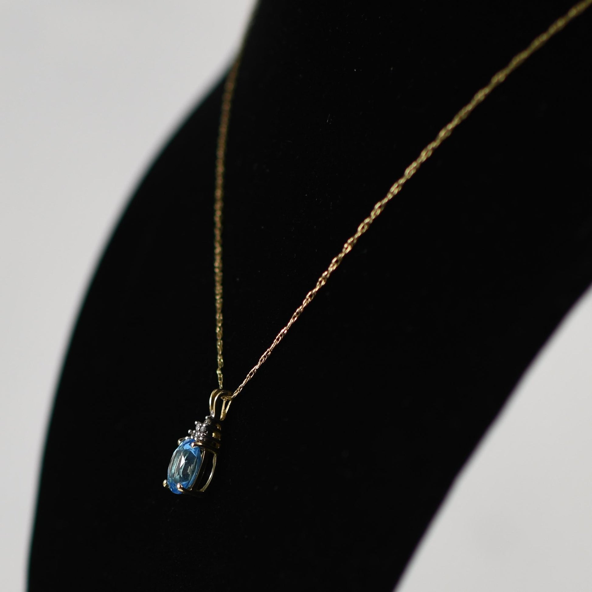 Blue Topaz Oval and Diamond Pendant on Chain in 14K Yellow Gold